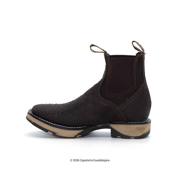 Brown leather boot with a white background