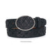 A black crocodile skin belt with a silver oval buckle, coiled on a white background.