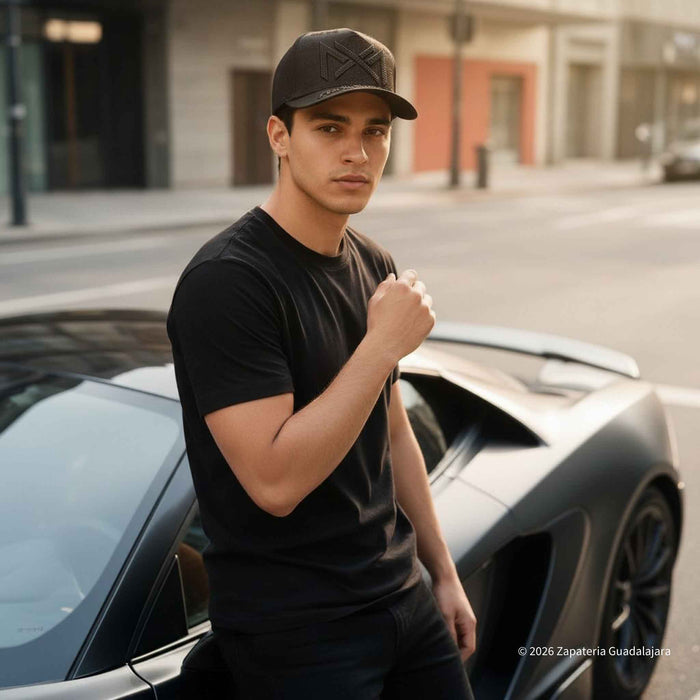 a young guy wearing a cap with mexico embroidered with rhines tones