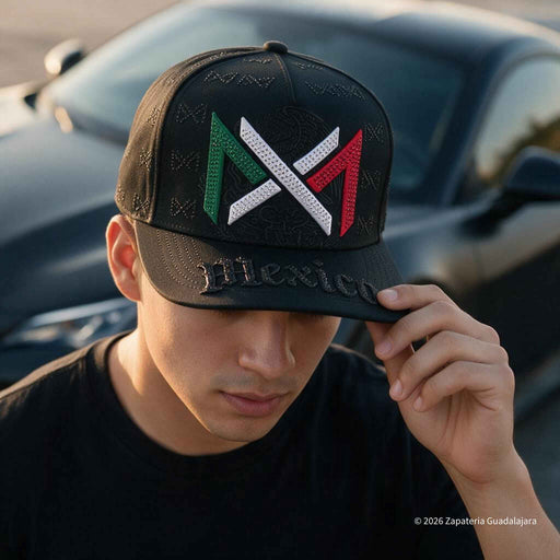 a young guy wearing a black cap with mexico tricolor embroidered with shinestones and a new car in the background