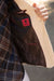 Close-up of a jacket with a red label on a blurred background