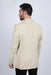 Man wearing a beige blazer on a white background
