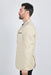Man wearing a beige blazer on a white background