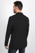 Man wearing a black coat on a white background