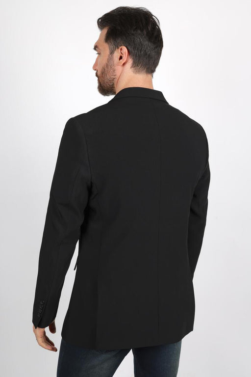Man wearing a black coat on a white background