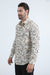 Man wearing a patterned shirt on a white background