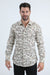 Man wearing a patterned shirt on a white background