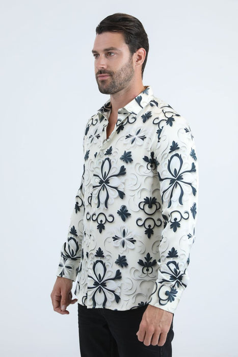 Man wearing a white shirt with black floral patterns on a white background