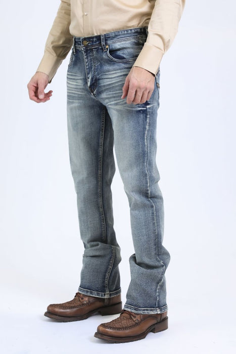Person wearing light blue jeans and brown shoes on a white background