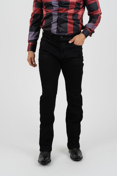 Person wearing a red and black plaid shirt with black pants on a white background