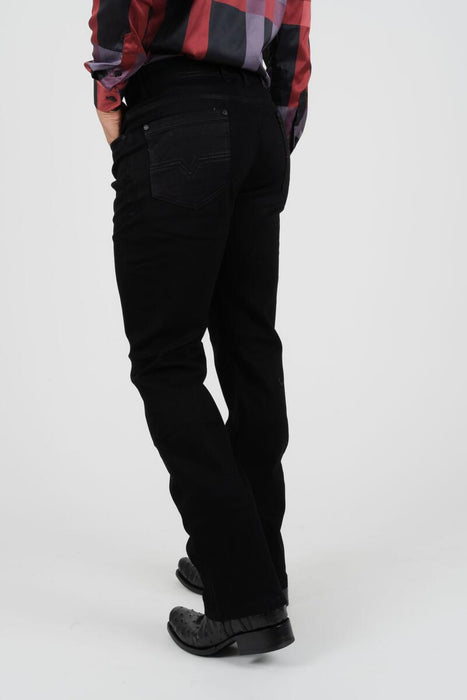 Person wearing black pants and a plaid shirt on a white background