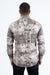 Man wearing a patterned shirt with a white background