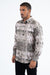 Man wearing a patterned shirt on a white background