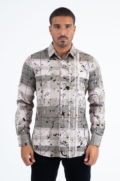 Man wearing a patterned shirt on a white background