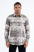 Man wearing a patterned shirt on a white background