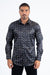 Man wearing a patterned dark shirt on a white background