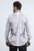 Man wearing a patterned shirt with a white background