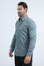 Man wearing a blue patterned shirt on a white background