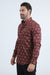 Man wearing a patterned red shirt on a white background