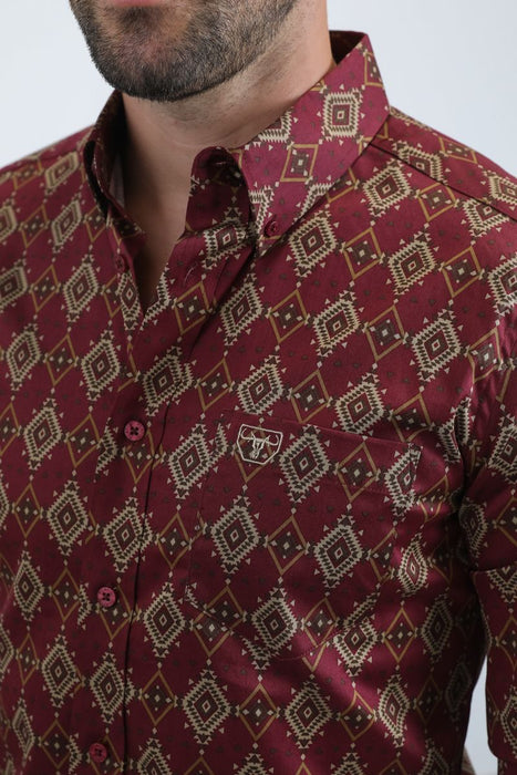 Maroon patterned shirt worn by a person on a white background