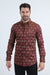 Man wearing a patterned red shirt on a white background