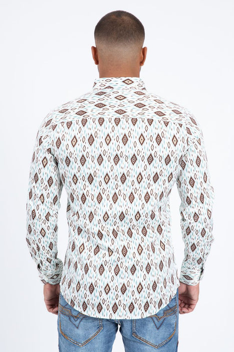 Man wearing a patterned shirt and jeans on a white background