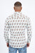 Man wearing a patterned shirt and jeans on a white background