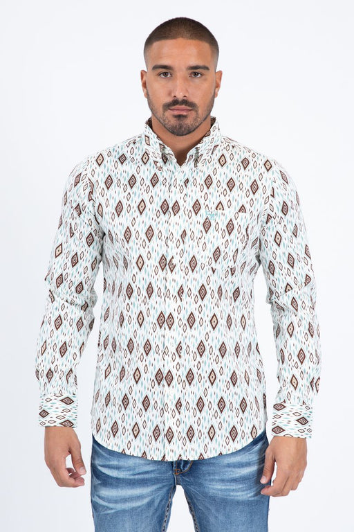 Man wearing a patterned shirt and jeans on a white background