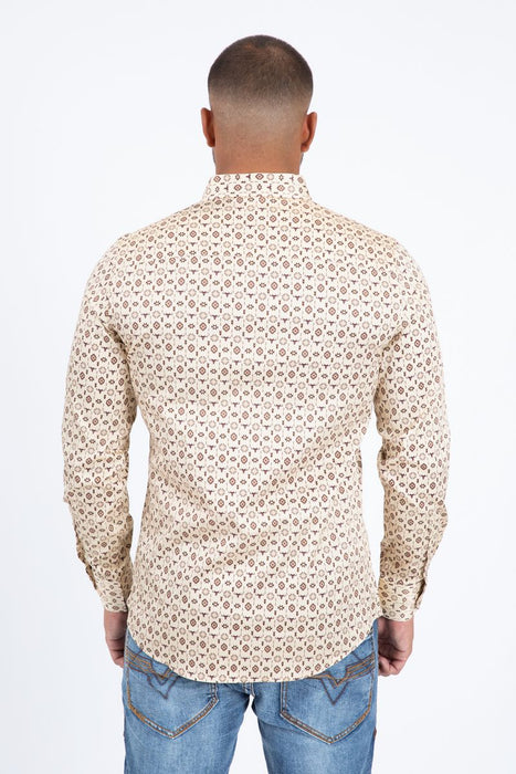 Man wearing a patterned shirt and jeans on a white background