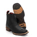 A pair of black charro boots with a wide square toe and rubber sole, made of genuine leather, displayed against a white background.