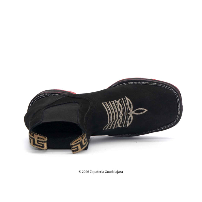 Black sandal with gold accents on a white background