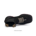 Black sandal with gold accents on a white background