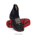 Black and red slip-on shoes with visible branding on a white background