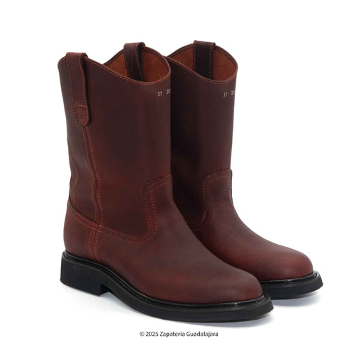 Pair of brown leather boots on a white background