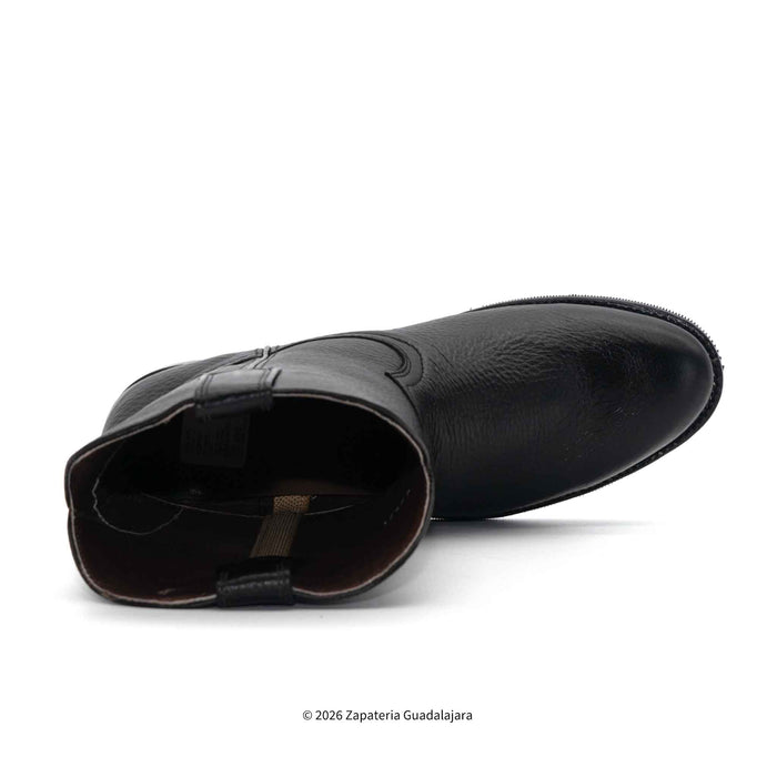 Black leather boot on a white background