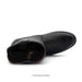 Black leather boot on a white background