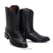Pair of black leather boots on a white background