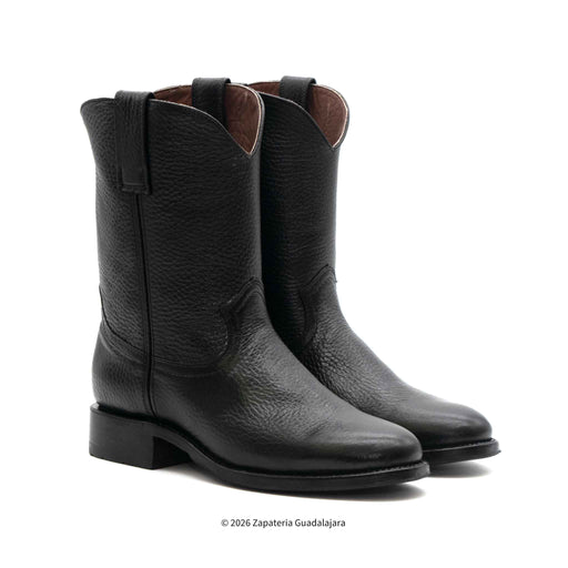 Pair of black leather boots on a white background
