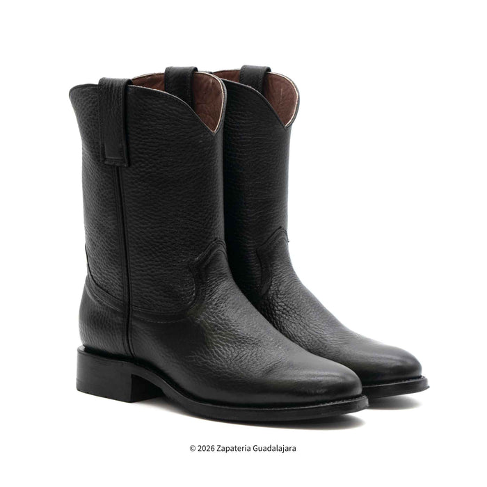 Pair of black leather boots on a white background