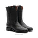 Pair of black leather boots on a white background