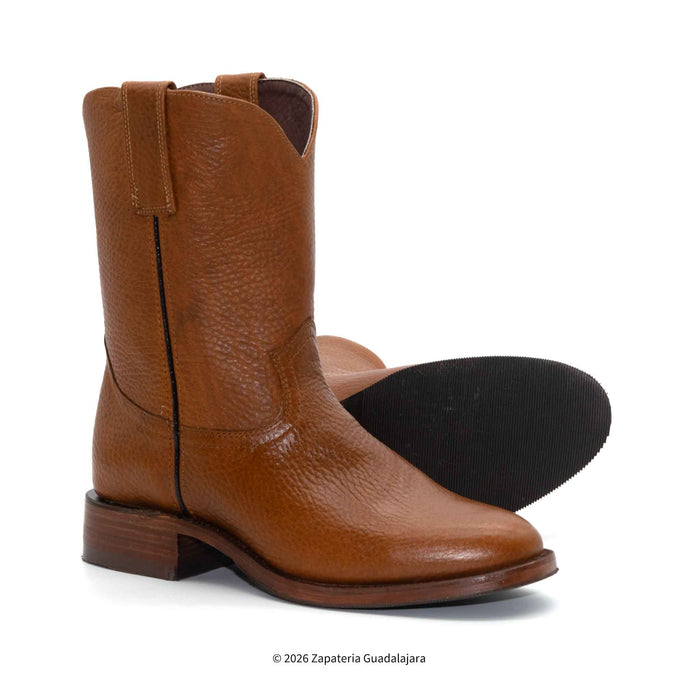 Brown leather boots on a white background