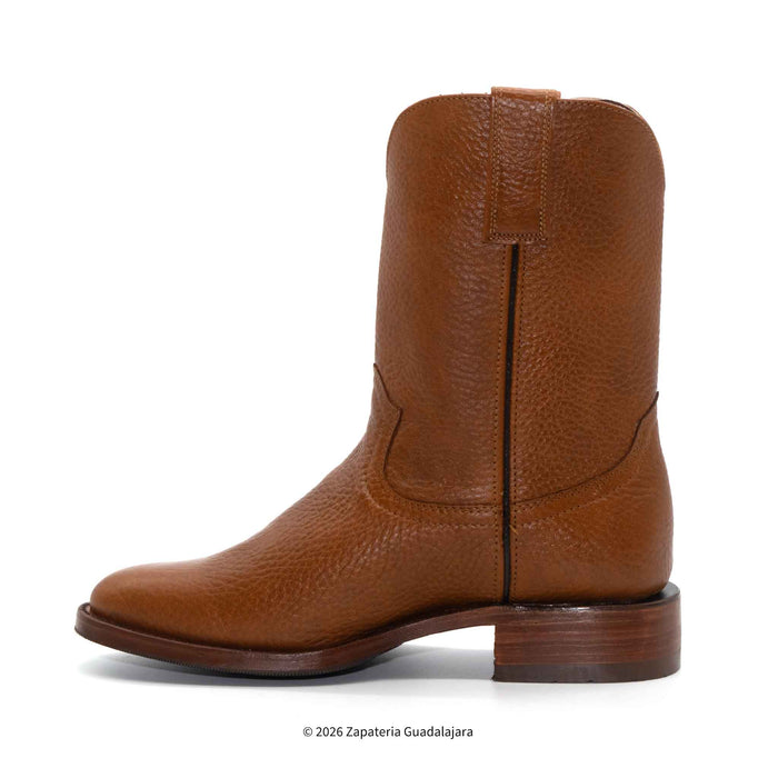 Brown leather boot on a white background