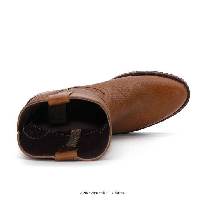 Brown leather boot on a white background