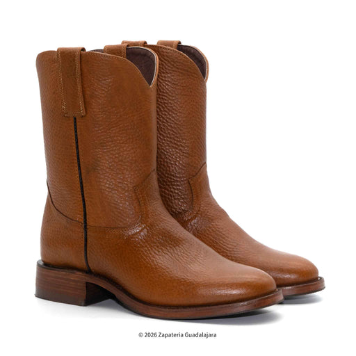 Pair of brown leather boots on a white background
