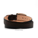 A dark brown textured leather belt coiled on a white background, showing its tan interior lining and a small embossed logo.
