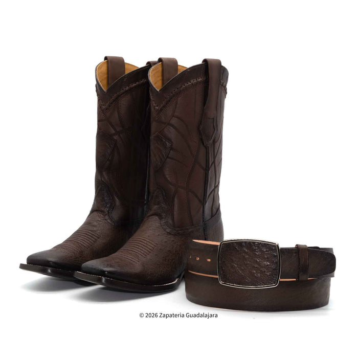 A pair of dark brown textured leather cowboy boots shown with a matching dark brown leather belt featuring a large embossed buckle, set against a plain white background.