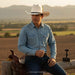 cowboy wearing TOMBSTONE 1000X TELAR CHAPARRAL BLACK BELT hat