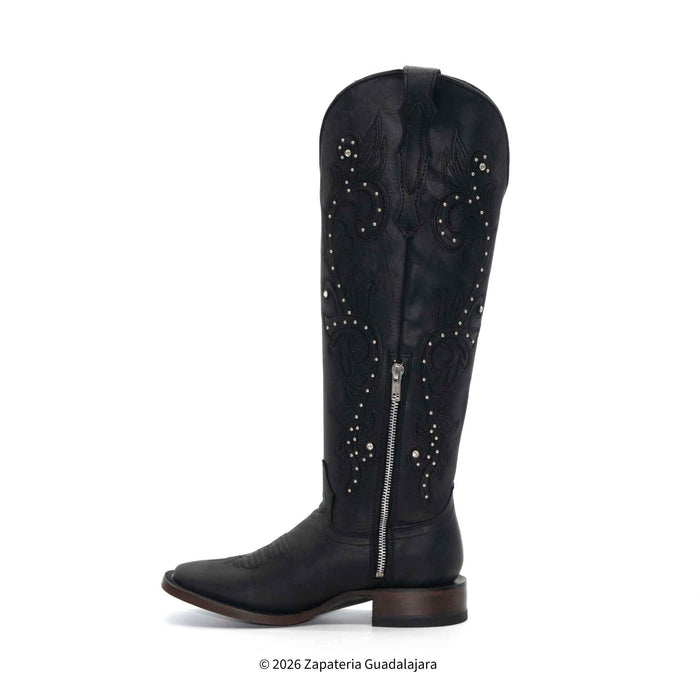Black knee-high boot with studded details on a white background