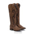 Brown cowboy boots with intricate designs on a white background
