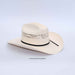 Beige cowboy hat with a black band on a light gray background